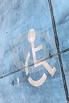 Blue handicap sign at a parking lot