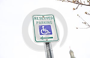 Blue handicap sign on the street - a symbol for mobility aid for people with disabilities