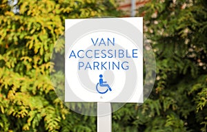 Blue handicap sign on the street - a symbol for mobility aid for people with disabilities