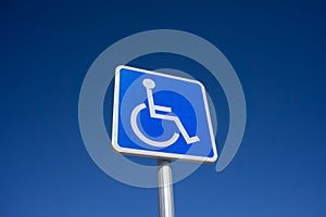Blue Handicapped Parking Sign with Blue Sky Background