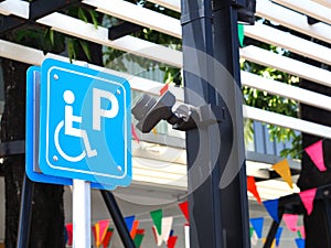 Blue handicapped parking sign at petrol station.