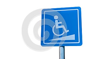 Blue handicapped parking symbol in car park on white isolated background.