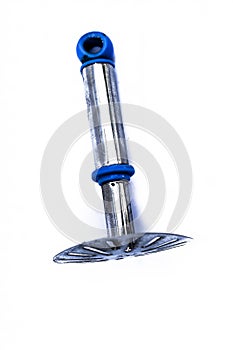 Blue handled stainless steel pav bhaji masher used to mash large batches of dish or vegetables on tava in streets of India,Isolate photo