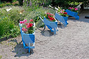 Blue handmade carts decorated with dahlias