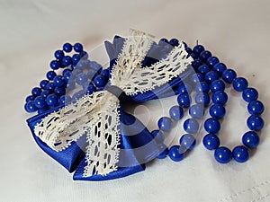 Blue Bow and a String of Pearls