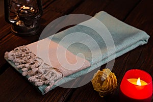 Blue Handwoven hammam Turkish cotton towel on dark wooden background