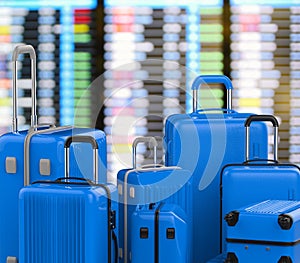 Blue hard case luggages with airport background