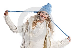 Blue hat on a blond girl, playing hat's braids