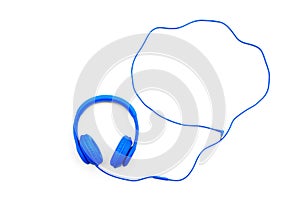 Blue headphones and wire isolated on white background with copy space. Music object concept