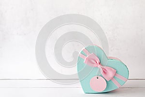 Blue heart Gift or present box with pink bow and tag on white background, card for Valentines day