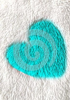 Blue heart on white blanket material