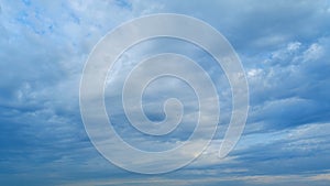 Blue heaven summer cloudscape. Rolling puffy white layered clouds are moving. Timelapse.