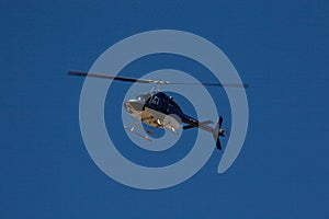 Blue helicopter in flight