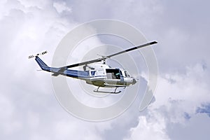Blue helicopter in the sky