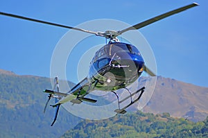 Blue helicopter landing
