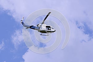 Blue helicopter in the sky