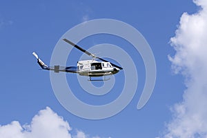 Blue helicopter in the sky