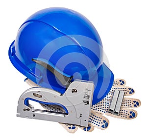 Blue helmet, gloves, furniture stapler, and staples for stapler  on white background