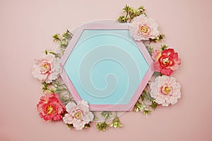 Blue Hexagon background and pink border decorate with flowers on pink background