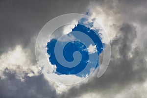 Blue hole peeks through the clouds