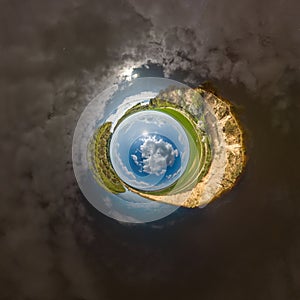 blue hole sphere little planet inside sand or dry grass round frame background