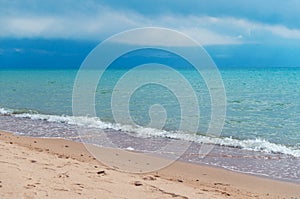 Blue horizon and brown sand