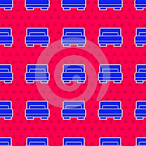 Blue Hotel room bed icon isolated seamless pattern on red background. Vector