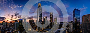 Blue hour with a deep red sunset over San Francisco skyline with Salesforce Tower in the center and the bay bridge on the