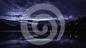 Blue hour in the dock of Caleta Tortel. The Pacific ocean coast can be appreciated.