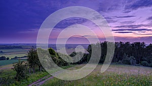 Blue hour light on the South Downs Way as it reaches the top of Old Winchester Hill, Hampshire, UK