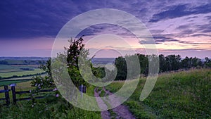 Blue hour light on the South Downs Way as it reaches the top of Old Winchester Hill, Hampshire, UK