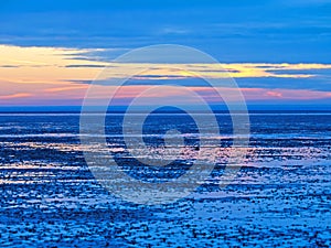 Blue hour in the Lower Saxony Wadden Sea off Cuxhaven Sahlenburg at low tide, Germany