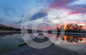 Blue hour over rowing channel in Plovdiv city - european capital of culture 2019, Bulgaria, Europe. Pier with boat in front.