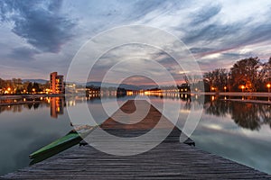Blue hour over rowing channel in Plovdiv city - european capital of culture 2019, Bulgaria, Europe. Pier with boat in front.