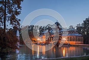 Blue hour view of Crystal Palace or Palacio de cristal in Retiro Park in Madrid, Spain.