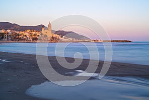 Blue hour view of mediterranean town of Sitges in Barcelona province. Spain.