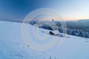 Blue hour in winter time in a remote mountain village Transylvania Romania