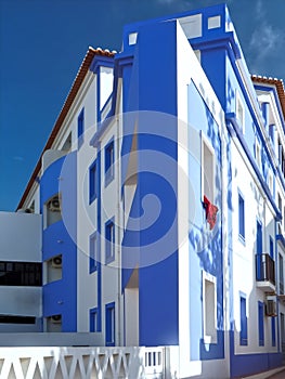 Blue house in Vila Nova de Milfontes in Portugal at river Mira