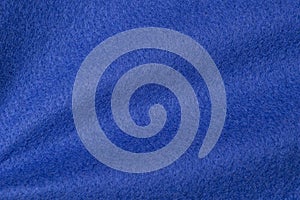 Blue hue color felt textile fabric texture background. Abstract geometric wave background