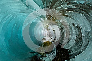 Blue Ice cave grotto on Olkhon Island, Lake Baikal, covered with icicles. Tiny little planet 360