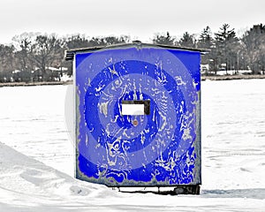 Blue Ice Fishing Shanty on Frozen Lake