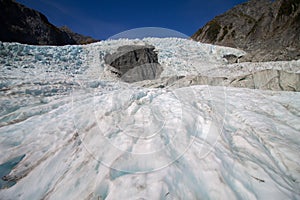 Blue ice on the Franz Josef Glacier with a blue sky