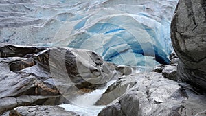 Blue ice of Nigardsbreen glacier arm in Autumn in Norway