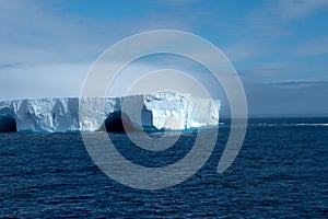 Blue Iceberg floating in Antarctica