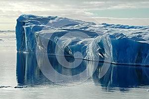 Blue iceberg with reflection