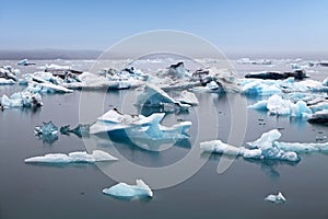 Blue icebergs floating in Jokulsarlon glacial lagook, Iceland
