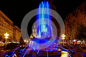 Blue illuminated fountain on the Plaza Opera in Timisoara