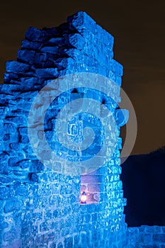 Blue illuminated ruin with burning petroleum lamp