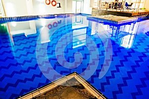 Blue indoor swimming pool