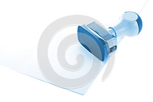 Blue Ink stamp over white paper